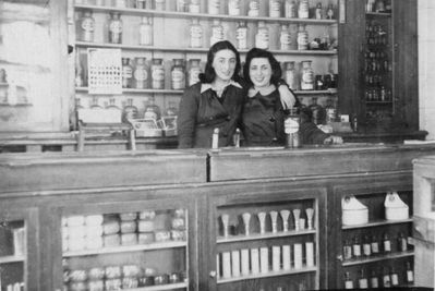Levin pharmacy and cosmetics shop in Tartu - 1941
The pharmacy at Raekoja plats in Tartu in 1941 after it was nationalized by Soviets. The owner Abram Levin was interrogated by NKVD several times and probably beaten. When Abram escaped from NKVD, he prefered to stay in Tartu with Germans rather than be with Soviets...  (J. Kaplan)
On the picture Mali Gordon (left) and Lea Eidus (Heimann) who worked in the shop. 
