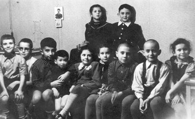 1952 - A birthday (8/10/1952), Tallinn
Left to right.
Sitting: Leonid Schats, Mark Rybak, Boris Besprosvanie, Ruben Murschak, Ilona Wolfson (Trapido), Olga Glubokovski (Amitan), Grigori (Gera) Trapido,  Marek Pakkin, Irina Amitan
Standing: Bella Popov (Murschak), Evgeni Berezovski 
... and with J. W. Stalin on the wall calendar
Keywords: [T] [M]