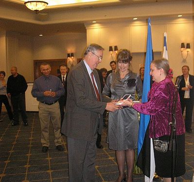 2 Mark Rybak receiving the White Star order from Mrs Ambassador
in the middle Estonian Chargé d'affaires in Israel Miss Marin Mõttus
