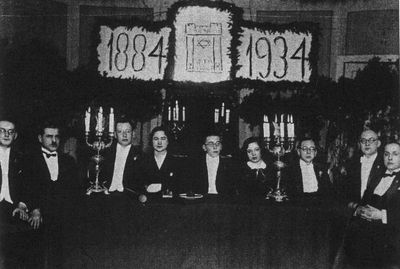 1934-2-24 - 50. Jubilee
From right to left.
S. Levin, R. Sirotinski, J. Pajenson, Zelda Levin (Murschak),  U. Gurevitsch, Bluma Freizus, B. Bakscht, Naftali Gens, M. Scheer
