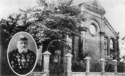 Tartu Great synagogue around 1930
The Great Synagogue at Turu str in Tartu. 
Was built in 1899-1902 and was burned by nazis in 1944. On the left Jacob Aharon Jakobson, one of the oldest and distinguished members of the community. Here in Fireman's uniform (it was a very  honorable voluntary position).
