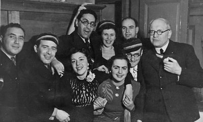 Limuvia
Left to right.
Sitting: Moissei Serman, Isak Braschinsky, Dora Geruchmanov (Rybak), ?, ?, ?
Standing: Ber (Baby) Levin, ?, Josif Pakkin, ?, Max Klompus?
