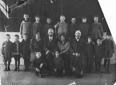 Tallinn - 1926. Jewish Gymnasium - I class in Hebrew - 1926
Left to right.
Teachers: Rabinovitsch from Palestine who came to teach Hebrew,  Samuel Gurin the director, Anna Feinstein - music teacher, Sauerbrei
