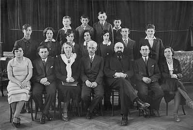 Tallinn - 1932. Jewish school -  1932 - VI class
First class to study in Hebrew - end of the elementary school in 1932.
Left to right.
Top row: Ben-Ami Lerenmann, Jossi Mesnikov, Bubi Lipavsky, Jacov Aronovitsch
Middle row: Philip (Fili) Brin, Resi Goldmann (Wasserman), Sara Schats, Njusa Passov, Riva Nesher (Itzoch), Zeev (Vulja) Schats, Ami Markovitsch
Sitting: Passov (Hebrew teacher), Kosotsky (Hebrew), Estonian teacher, the Director Samuel Gurin, Hazan Gurevitsch, Zitomirski, Agi Kellert (gymnastics teacher) 
Keywords: [A] [L] [M] [I] [W] [B] [P] [S]
