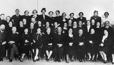 Tallinn - 1935.  Jewish gymnasium Parents committee  ~1935/6
Left to right.
Top row: ?, Pensa - the teacher of Estonian, Zitomirski - Hebrew teacher, ?, Vald?, Slutski, ?, ?, ?, ?, ?, Schulklepper, Rybka
Middle row (all): ?, ?, ?, ?, Isaak Bachmat, ?, Batja Schneeberg, ?, ?, ?, Grinstan, Daile Wasserman, Hoff (Vilenski, maiden ?), Dubovski
 Bottom row: Kantor Gurevitsch, Dr Fridland, Berta Goldmann, Press, Johansson - handicraft teacher, Samuil Gurin - the director, Frieda Berkovitsch, Hirsch (Grigori Aisenstadt) - the Chairman of the Cultural Autonomy, Itskovitsch, ?
