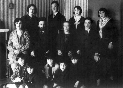 Gurevitsch family - Valga
Left to right
Top row: Rosa Gurevitsch - killed by nazis in Riga, Jakov Gurevitsch - after WWII died in Israel, Sara Gurevitsch - killed by nazis in Estonia, Selma Gurevitsch - left to Africa before the WWII (order not known - Selma, Sara), 
Middle row: Hanne (Anna) Gurevitsch died in Cheboksari during the WWII from hunger, Leib Gurevitsch (The rabbi of Valga, b. 1872, died in Valga before the WWII), Slate Gurevitsch (Judeikin) - b. 1882, died in Viljandi in 1952, Abram Gurevitsch (b. 1906, rabbi in Viljandi and Tallinn, died in Tallinn in 1983)
Bottom row: Lida Sulkin (daughter of Hanne) - in Canada, Bubi (son of Hanne) - died, Ida Grabe (Gurevitsch) - b. 1923, died in USA, Miriam Lazikin (Gurevitsch) - b. 1925, lives in Jerusalem, Bella (Berta) Israeli (Gurevitsch) - lives in kibuz Kfar Blum
On the wall - Keren Kayemet box
