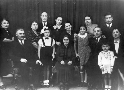 Ivanovski family 1938
Left to right. Sitting: Ore Ivanovski, Daisy Gelb (Grossmann), Beile Ivanovski, Sunda Ivanovski, Abram Leib Ivanovski, Abi Hasin, Batsheva (Keile) Hasin (Ivanovski).
Standing: Anna (Hana) Ivanovski, Jenny (Scheine) Grossmann (Kremer), Moritz Grossmann, Lidia (Pae) Morein (Ivanovski),  Selma Flaks, Freida Ivanovski (Scher), Aron Hasin
Keywords: [G]