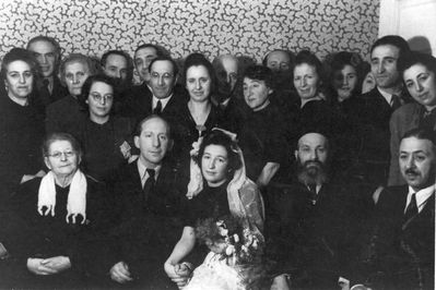 Issai Meilach wedding
Left to right.
Sitting: Sara-Ette Meilach (Katz), Issai Meilach, his wife, Rabbi Aba Gomer, ?
Standing: ?, ?, ?, Irene Falstein (Klas), ?, ?, ?, Zilla Margolin (Meilach), Boris Meilach?, ?, Asriel Meilach, Berta (Bella) Orkin (Meilach), ?, ?, ?, Lea Eidus (Heimann)?
