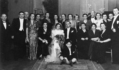 Aronstam wedding - 1937 - in Jewish club at V. Karja 1/9 (III floor)  in Tallinn
Left to right.
Upper row: Leib Hait, Abba Fürst, Samuil Slutski, Mira Matskin, Lena Dymschits (Finberg), Rosa Slutski (Finberg), ?, ?, Bronislava Golomb (Scher, nee Dymschits), Meri Aronstam, Betti Aronstam, Willi Matskin, Dina Slutsk, ?, ?, ?
Sitting: Fenja Hait, Cecilija Aronstam (Hait), Maks Aronstam, Scheine Aronstam, ?, Berta Matskin
The boy: Isak Fürst
