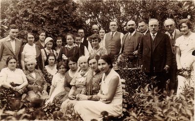 Bar mizva of Teodor Polykovski - 1933
Left to right.
Standing: ?, Anna Klas (Gurevitsch), ?, ?, ?, Varvara Delajev (the nanny), Teodor Polykovsky, Samuil Polykovski, ?, ?, ?, ?, Jossif Gurevitsch, ?, ?, Leib Levitin, ?
Sitting: Sonya Polykovski, ?, ?, ?, ?, Braine Levitin, ?, ? 
