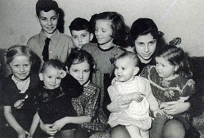 Children ~1949
Left to right.
Standing:  Gabi Hasak, Marek Pakkin, Regina Pessin 
Sitting: Piret Järvekülg, Marianna Järvekülg with Davik Schechtmeister, Evi Hasak with Sima Pakin (left) and an unknown girl.
