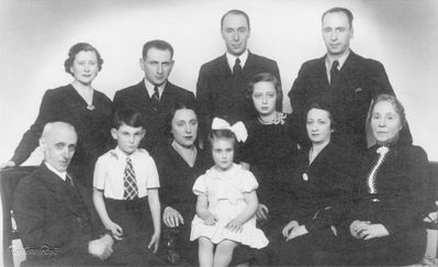 Schatz family - 1938/39 Riga
Left to right.
Sitting: Michel Schatz, Greta ? (Schatz) with children, Mara Pasternak (Schatz), Ljuba Schatz (Aisenstadt), Annette Schatz (Veinberg)
Standing: Lidia Schatz (?) wife of Aleksander, ? (Greta's husband), Aleksander Schatz, Isak Schatz
Michel, Annette, Aleksander and Lidia were killed in Riga gheto

