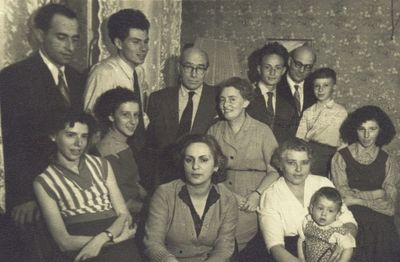 Rubanovitsch - 1957
Left to right.
Bottom row: Hani Zautin (Usvanski), Dina Gabovitsch (Dymschits), Miriam Usvanski (Gabovitsch) with Vadim Zautin
Second row: Zoja Gabovitsch (Skulski), Bluma Rubanovitsch (Gabovitsch), Karmela Usvanski
Top row: Anatoli Zautin, Jevgeni Gabovitsch, Jascha Rubanovitsch, Michael Rubanovitsch, Jacov Gabovitsch, Grigori Rubanovitsch
