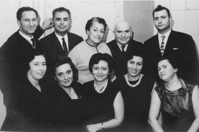 Tuvja Smolenski's 50th birthday - 1963, Tallinn
In 1963 my [Rachel Zivjan] cousin Tevye Smolenski celebrated his 50th birthday in Tallinn. It was an unforgettable party at which all the relatives who then lived in Estonia came together. This photograph was taken during his anniversary celebration.

Standing in the upper row (left to right): Tevye Mayofis, aunt Basya’s son, who now lives in Israel; Tevye Smolenski, aunt Haya-Fanny's son, who lived and died in Israel; Sofia Furmanski, nee Heiman, aunt Rasse’s daughter, who lived and died in Tallinn; Tevye Feiman, Aunt Berta’s son, who lived and died in Estonia; Boris Smolenski, Aunt Haya-Fanny’s son, who now lives in the USA.
Sitting in the lower row (left to right): Riva Koslovski, nee Tsivian, my sister, who lived and died in Tallinn; Leah Bolonov, nee Tsivian uncle Samuel’s daughter, lived and died in Tallinn; Rasse Paturskaya, nee Heiman, uncle Samuel’s daughter, who lived and died in Tallinn; Leah Eidus, nee Heiman, uncle Leib-Zelik’s daughter, who now lives in Israel; and me. 
