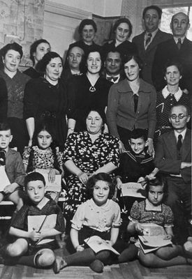 Rogovski family in 1939
Left to right.
At top: ?, ?, Elhanan Rogovski, Dr Bassel
II row: Sonja Rogovski, Hana Ring, Sonja Saks, Israel Dubovski (math teacher in Yidish), Selma Schur, ?, Dr Bassel, Manja Feigin
III row: Scharl Feigin, Lia Saks, Fanja Dubovski, Tolja Bassel, Efraim Rochlin
at bottom:  Haim Raichman, Lia Rogovski, Ruth Ring 
