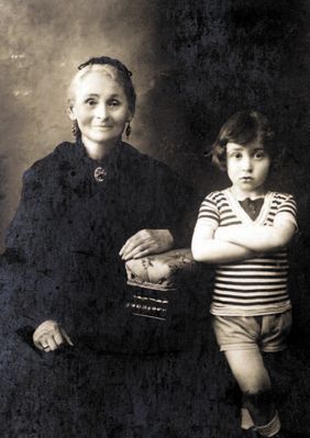 Haya-Sore Zivjan
This photograph shows Rachel Randvee paternal grandmother, Haya-Sore
Tsivian, and her grandson, Yakov Israelson. It was taken in the
summer of 1916, which Yakov spent at his grandmother's in
Riga.
Grandma Haya-Sore was pretty even in her old age, and she
was an unapproachable beauty in her youth. She told us how
long it had taken her to choose a husband and her father had
been very annoyed by this. Every one of grandma's sisters had
families of their own at the age of 14 or 15, but she did not
marry until she was 18.
