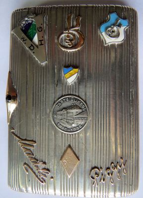 The cigarette case presented to A. Gini (Ginizisky) at the day of his departure to Palestine (3.12.1935). Tartu. 
In the middle - the sign of 300 years to Tartu University. Above it - Hasmonea coat of arms.
