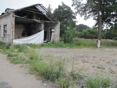 Empty space in front of the burned house is where the wooden synagogue building was standing. The stone house was used for the offices of the synagogue.
2013
