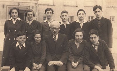 Tallinn - 1937. Jewish School. May 1937
Left to right.
Sitting: Harry Rybka, Roche Lea Naimark, Samuel Gurin, Lidia Morein (Ivanovski), ?
Standing: Lia Freidin (Rubanovitsch), Resi Vseviov (Vald), ?, Leib Braschinski, Hirsch Gleser, Pesach Freidin
Readable names on back:   Itzhak Danziger,  
