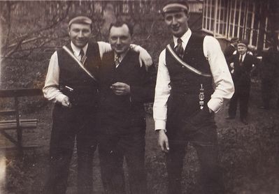 With full colors
Left to right: ?, ?, Aleksander Kan 
